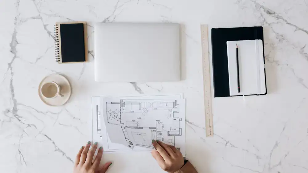 Architectural garden design masterplan spread on a desk